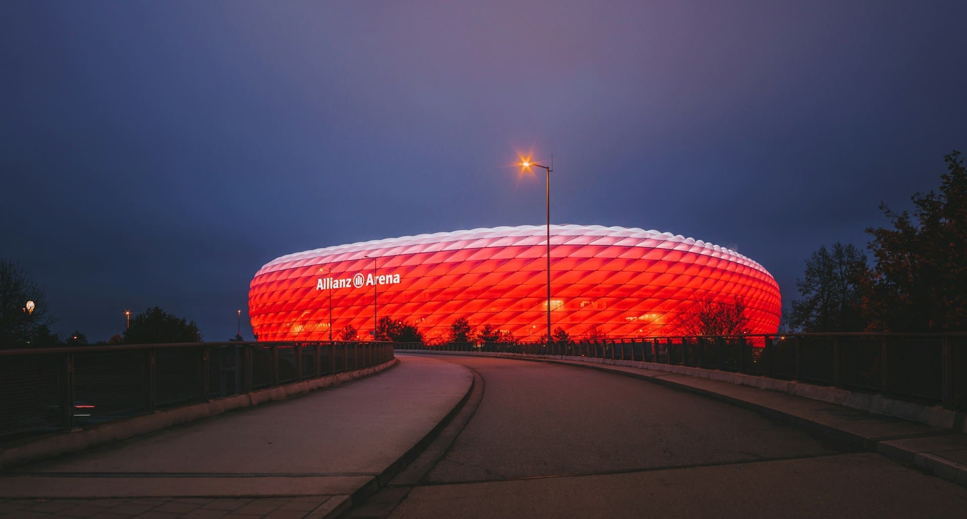 A photo of Allianz Arena in Munich, taken at night.